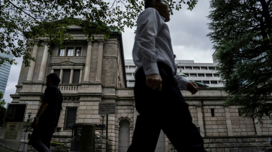 Asian stocks boosted by falling oil, yen weakens after BoJ rate hike