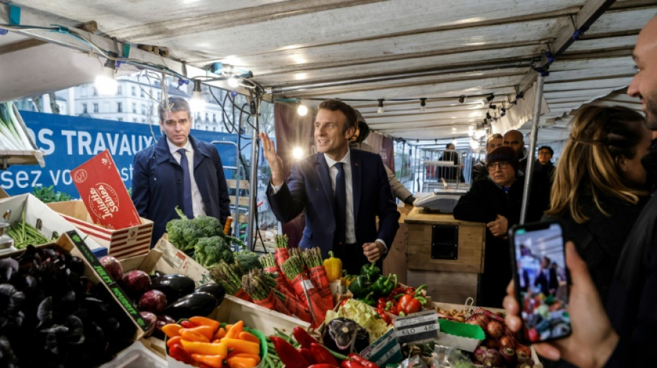 Macron targets Le Pen as election lead narrows