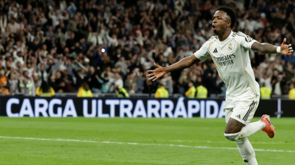 Vinicius double helps Real Madrid edge Atletico thriller