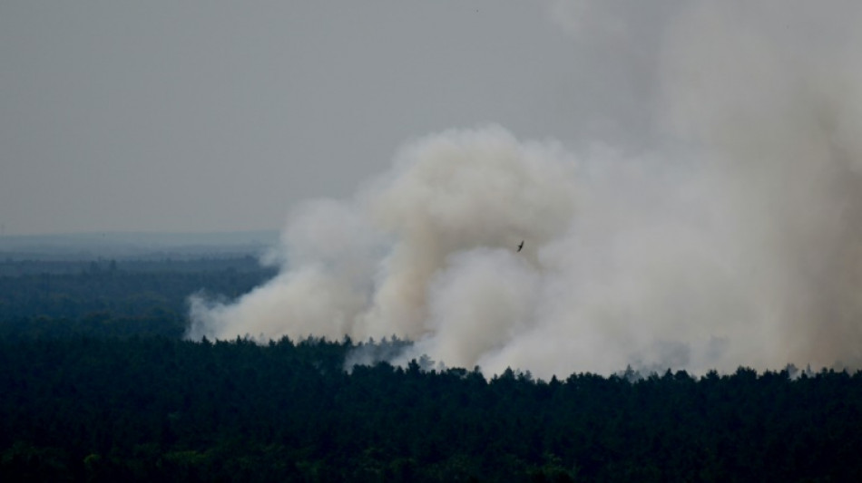 Blasts ring out as fires rage in Berlin forest