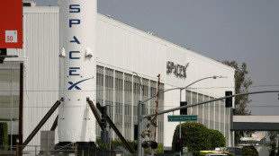 Dow edges to record as markets parse prospects for Hormuz deal